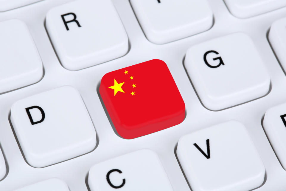 A Chinese flag replacing the "F" key on a computer keyboard.