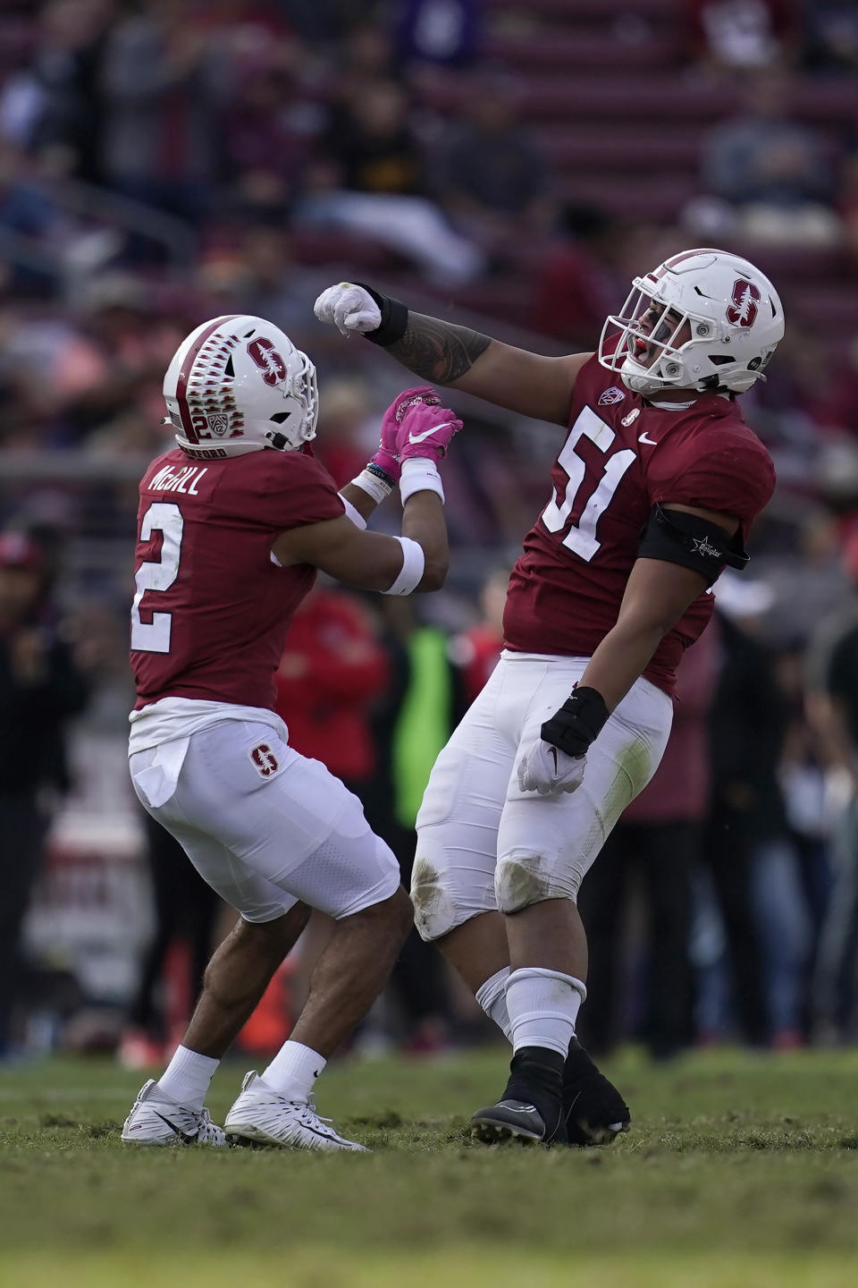 Stanford safety Jonathan McGill (2) celebrates with defensive lineman Jaxson Moi (51) during the second half of an NCAA college football game against Arizona State in Stanford, Calif., Saturday, Oct. 22, 2022. (AP Photo/Jeff Chiu)