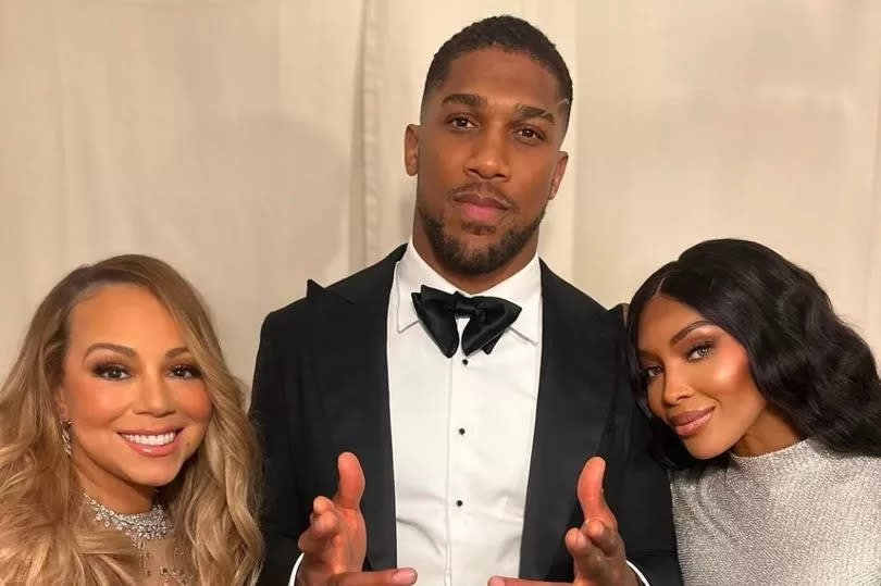 Anthony Joshua with Mariah Carey and Naomi Campbell at the glitzy wedding -Credit:Instagram/@AnthonyJoshua