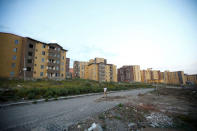 A man walks within the Yeka Abado condominium under construction on the outskirts of Ethiopia's capital Addis Ababa, October 19, 2016. REUTERS/Tiksa Negeri