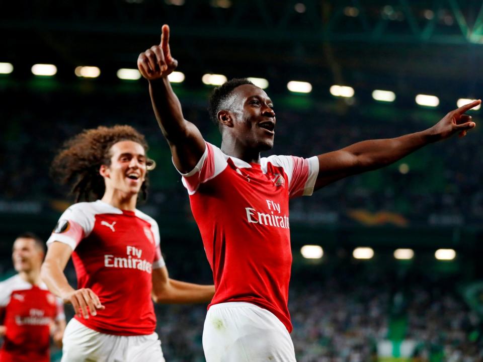 Danny Welbeck celebrates hitting the winning goal in Lisbon: Reuters