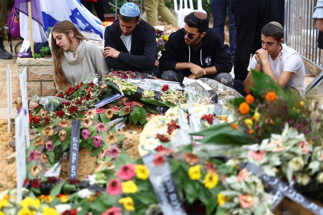 People mourn corporal Dvir Lisha, 21, an Israeli soldier who was killed following Hamas’s attacks (REUTERS)