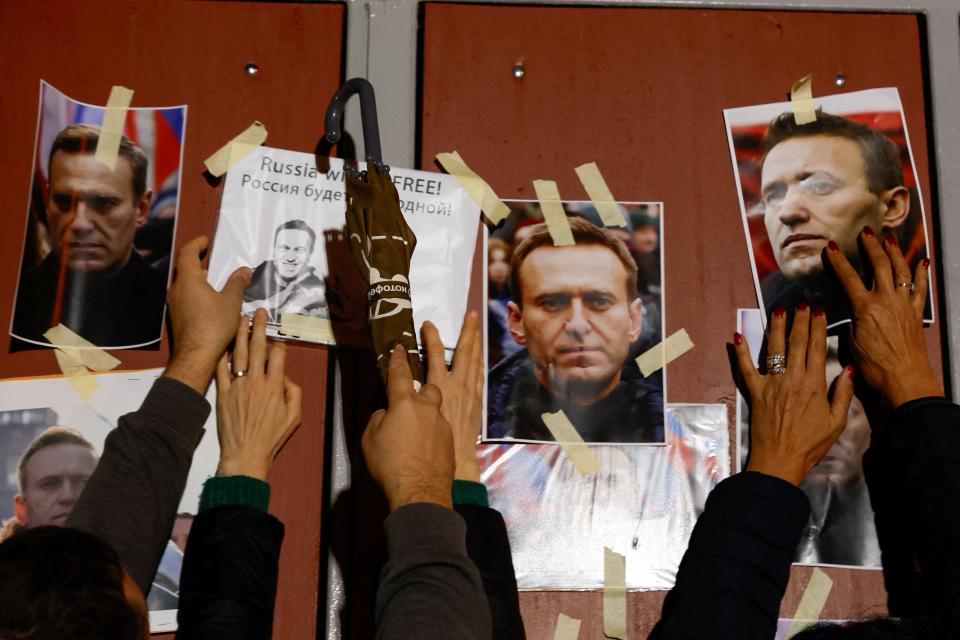 People attend a protest and vigil following the death of Russian opposition leader Alexei Navalny, in Kappara (Reuters)