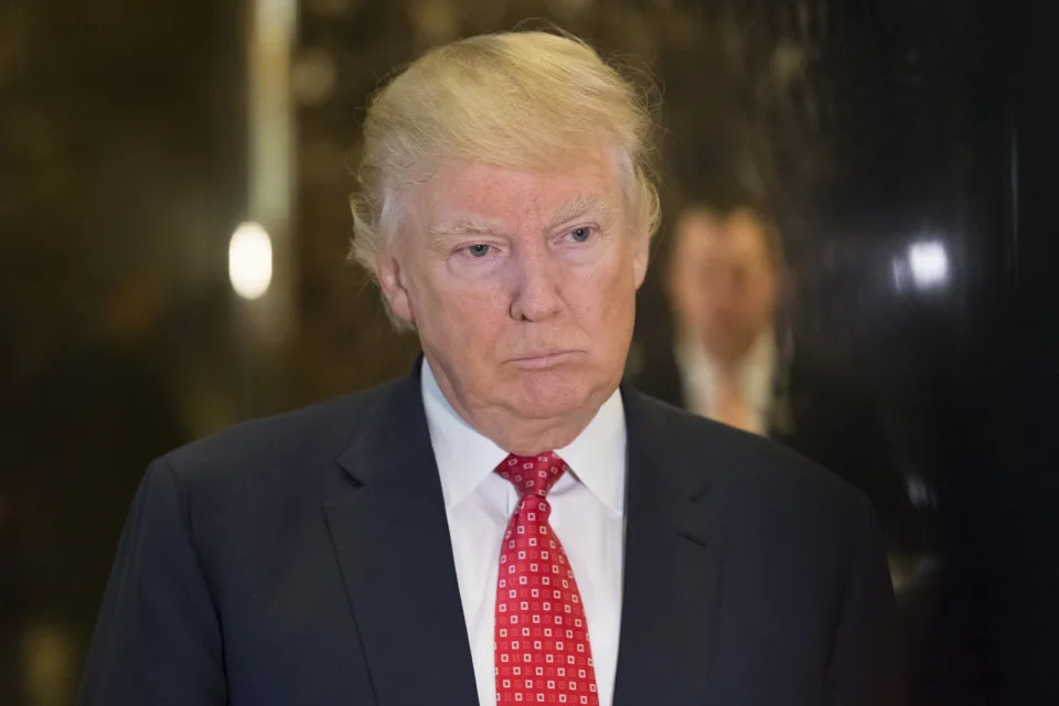 Donald Trump and political officials seen in the Trump Tower lobby in NYC