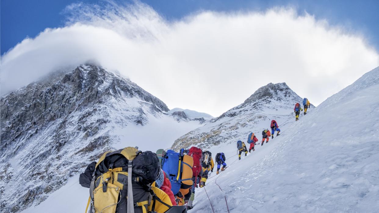  An expedition makes its way up Mount Everest. 