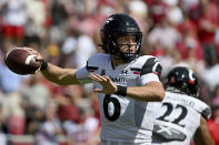 Cincinnati quarterback Ben Bryant (6) throws a pass against Arkansas during the first half of an NCAA college football game Saturday, Sept. 3, 2022, in Fayetteville, Ark. (AP Photo/Michael Woods)
