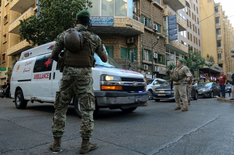 Lebanese army soldiers secure the area for an ambulance to enter the premises of the American University hospital. Eight people have been killed and some 2,750 injured in suspected coordinated explosions of hand-held telecommunications devices across Lebanon, Health Minister Firas Abiad said during a press conference in Beirut on 17 September. Marwan Naamani/dpa