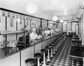 <p>As the '40s went on, the look of the <a href="https://archive.curbed.com/2017/5/30/15716116/restaurants-diners-prefab-historic-preservation" rel="nofollow noopener" target="_blank" data-ylk="slk:diner continued to change;elm:context_link;itc:0;sec:content-canvas" class="link ">diner continued to change</a>. Booths replaced tables, Formica countertops and stainless steel stools became staples, and neon signs were hung outside. </p>