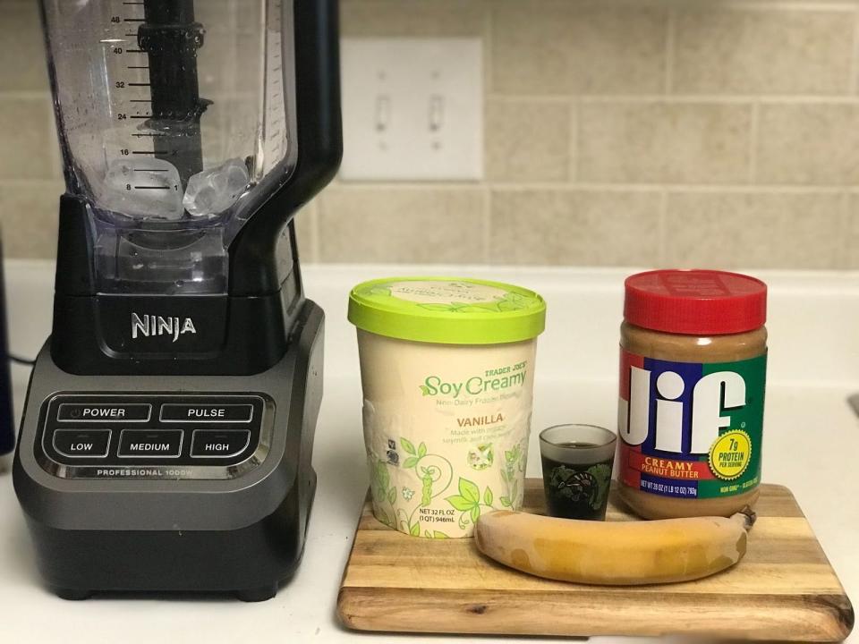 The ingredients laid out for the Survivor smoothie and a blender