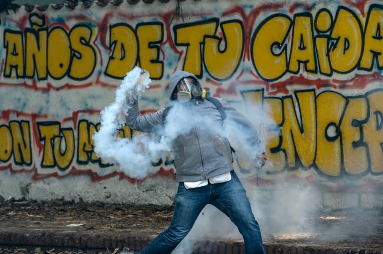 Students clash with riot police in Venezuela where the death toll from anti-government unrest continues to mount