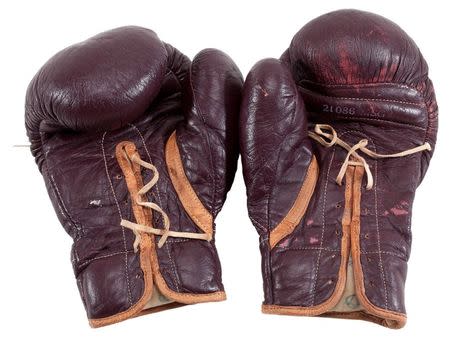 Boxing gloves worn by Muhammad Ali during his March 8, 1971 “Fight of the Century” in Madison Square Garden against Joe Frazier are pictured in this undated handout photo obtained by Reuters July 11, 2016. Goldin Auctions/Handout via REUTERS