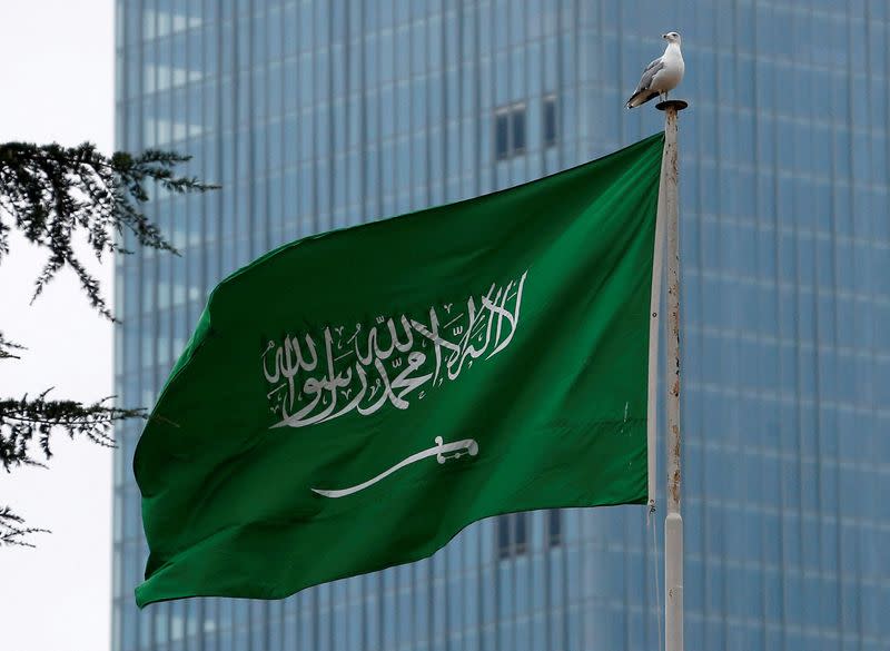 FILE PHOTO: A Saudi flag flutters atop Saudi Arabia's consulate in Istanbul