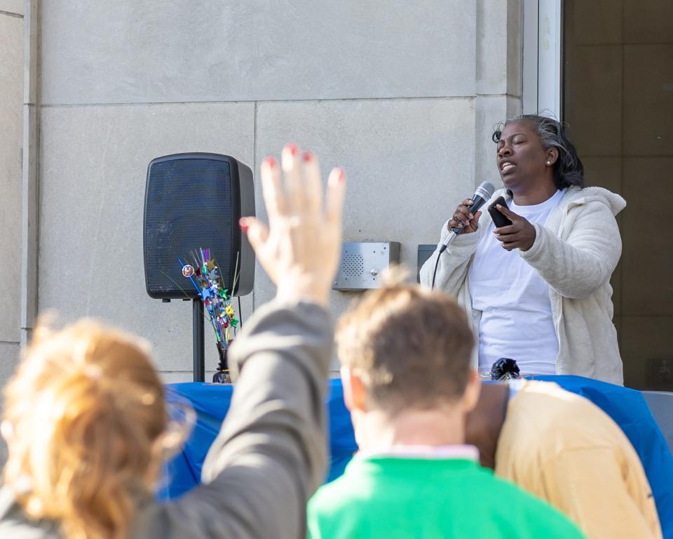 Jacqueline Bolden of Jackson starts the No Prayer, No Peace March with a prayer before walking the streets of downtown Jackson to spread more prayer and positivity Saturday, Oct. 7. The event, hosted by the Jackson Police Department, is part of National Faith & Blue Weekend.