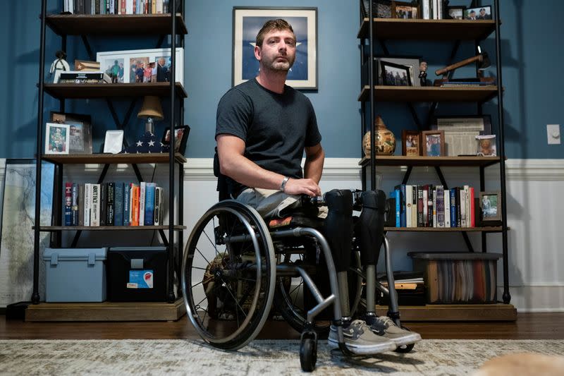 Retired Army Captain Dan Berschinski poses for a portrait at his home in Atlanta