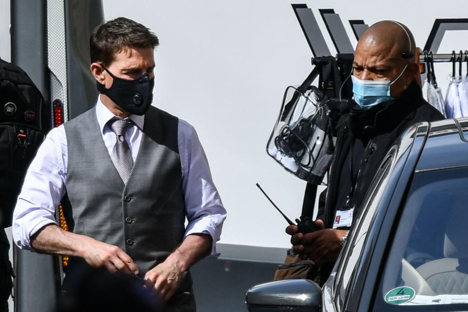 Cruise wearing a face mask on set in OctoberAFP via Getty Images