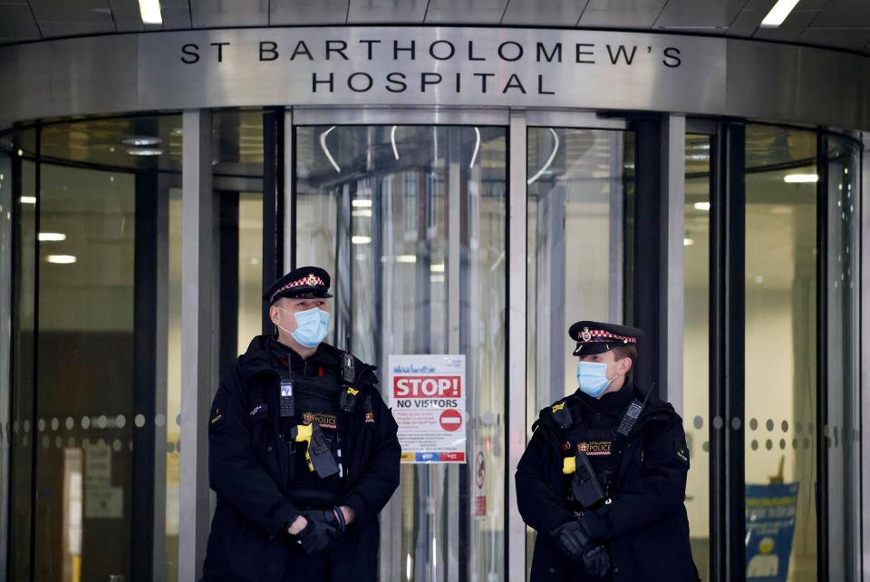 Police officers stand on duty outside St Bartholomew's Hospital, commonly known as St Barts, in central London on March 4, 2021 where Britain's Prince Philip, Duke of Edinburgh was transferred to on March 1.