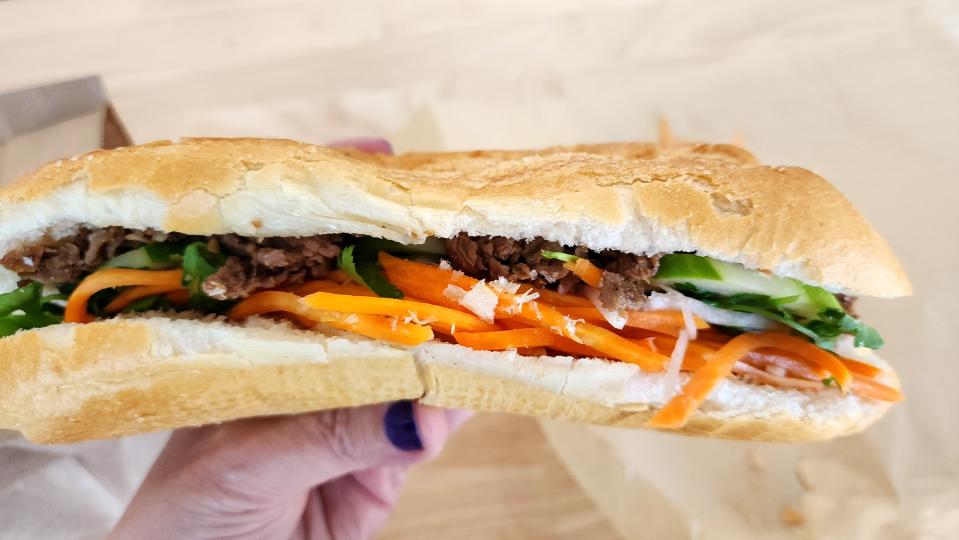 Banh Mi, the Vietnamese baguette at Lotus Pepper, is filled with homemade mayo, cucumber, carrot and daikon pickles, cilantro and your choice of protein.