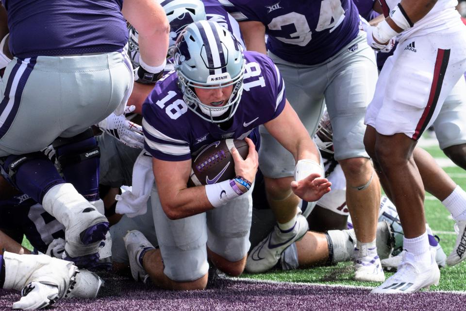 Kansas State quarterback Will Howard (18) dives into the end zone for a touchdown against Troy last Saturday at Bill Snyder Family Stadium.