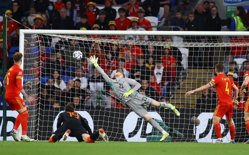 Wout Weghorst of Netherlands scores their sides second goal past Adam Davies - GETTY IMAGES