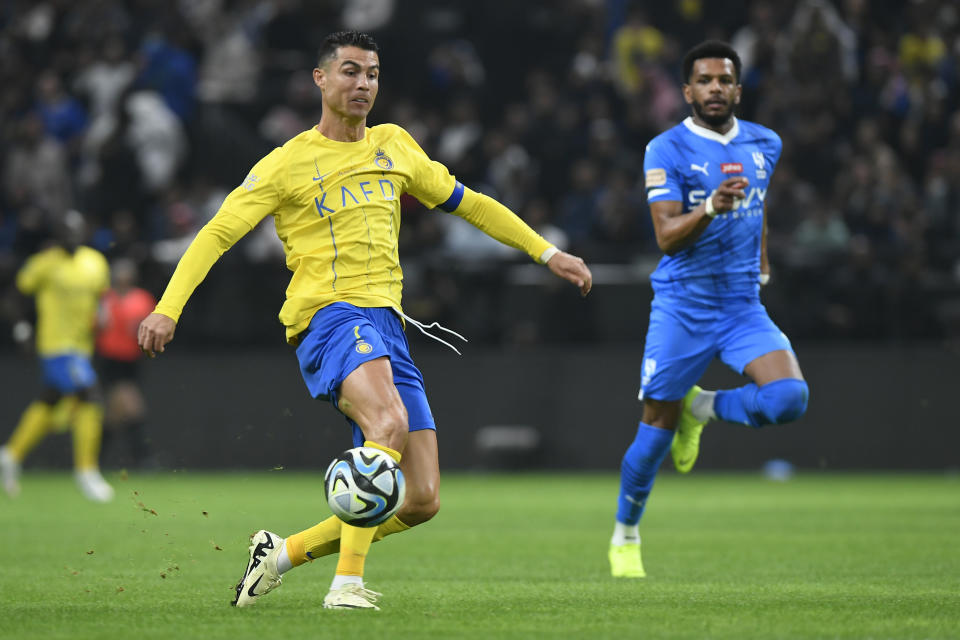 Al Nassr's Cristiano Ronaldo kicks the ball during Riyadh Season Cup 2024 final match against Al Hilal at Kingdom Arena Stadium in Riyadh, Saudi Arabia, Thursday, Feb. 8, 2024. (AP Photo)