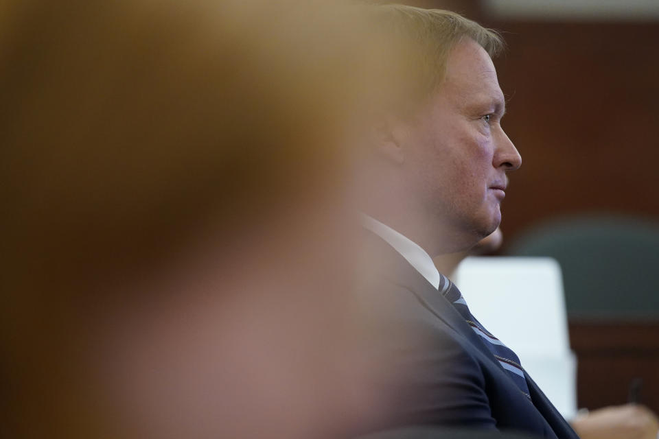 Jon Gruden listens in court Wednesday, May 25, 2022, in Las Vegas. A Nevada judge heard a bid Wednesday by the National Football League to dismiss former Las Vegas Raiders coach Jon Gruden's lawsuit accusing the league of a "malicious and orchestrated campaign" including the leaking of offensive emails ahead of his resignation last October. (AP Photo/John Locher)