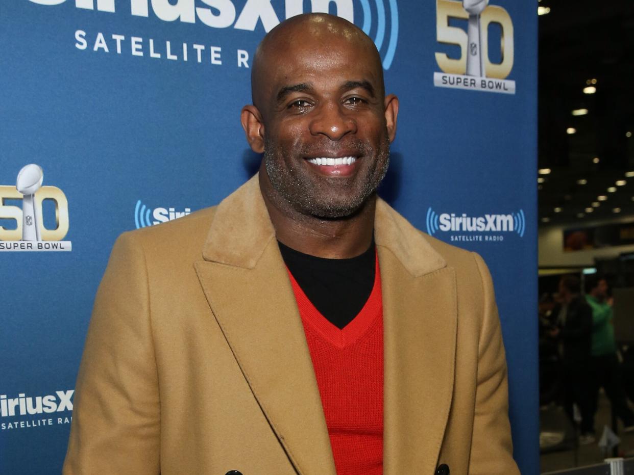 Deion Sanders visits the SiriusXM set at Super Bowl 50 Radio Row at the Moscone Center on February 4, 2016 in San Francisco, California