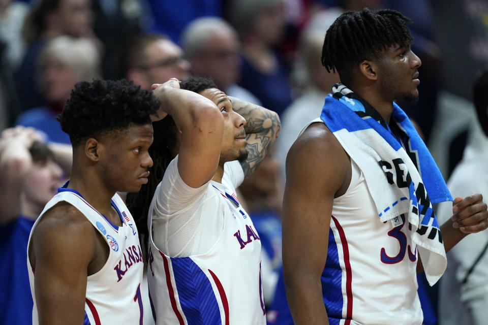 Kansas players watch from the bench in the second half of a second-round college basketball game against Arkansas in the NCAA Tournament, Saturday, March 18, 2023, in Des Moines, Iowa. (AP Photo/Charlie Neibergall)