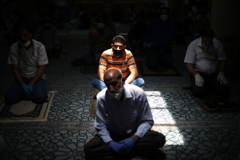 Muslims attend Friday prayers at al Husseini mosque in Amman