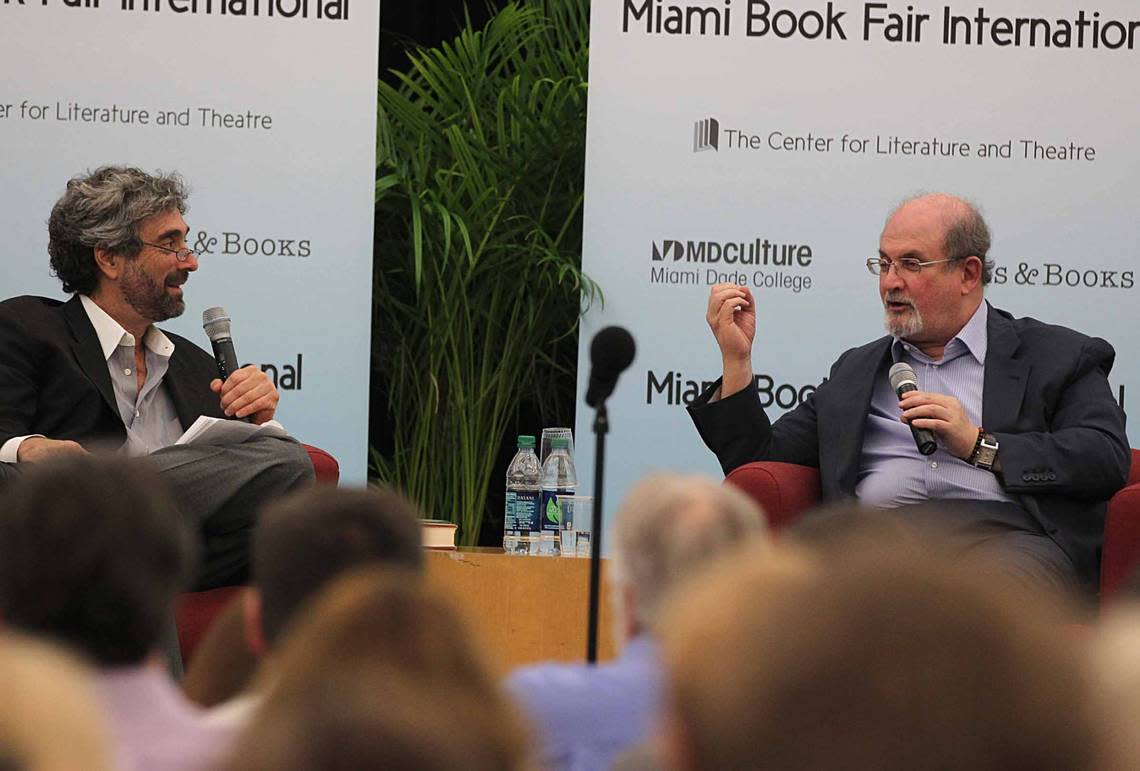 Mitch Kaplan (left), chats with best selling author Salman Rushdie, during a presentation of his book “Joseph Anton” in 2013.