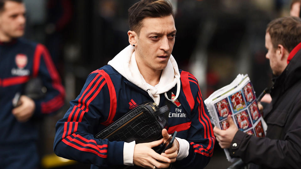 Arsenal midfielder Mesut Ozil has been axed by the Premier League club, but will continue to earn his record salary. (Photo by OLI SCARFF/AFP via Getty Images)