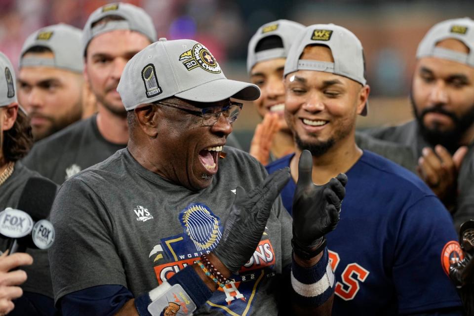 Houston Astros manager Dusty Baker celebrates after clinching the World Series on Saturday night (AP)
