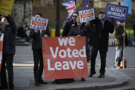 Leave the European Union, Brexit supporters protest across the street from the House of Parliament in London, Tuesday, Dec. 11, 2018. Top European Union officials are ruling out any renegotiation of the divorce agreement with Britain as Prime Minister Theresa May fights to save her Brexit deal by lobbying leaders in Europe's capitals. (AP Photo/Matt Dunham)