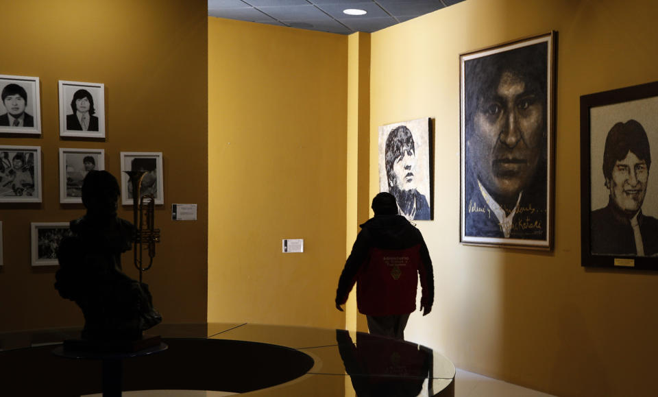 In this Sept. 13, 2019 photo, photos of Bolivia's President Eva Morales adorn the walls at the Democratic and Cultural Revolution Museum in Orinoca, Bolivia. The museum in a remote town high up in the deserts of the Bolivian altiplano was built by President Morales in his birthplace of Orinoca to honor the country’s indigenous peoples. (AP Photo/Juan Karita)