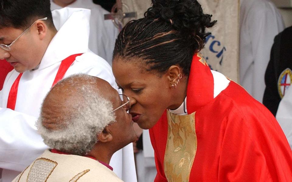 Mpho Tutu van Furth kissing her late father the Archbishop Desmond Tutu - Reuters