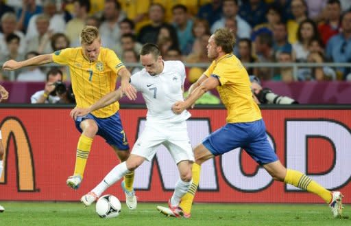 French midfielder Franck Ribery (C is challenged by Sweden's Sebastian Larsson (L) and Andreas Granqvist during their Euro 2012 match on June 19. Sweden were the side that looked to be the one who had a chance of reaching the quarter-finals rather than taking an early flight home