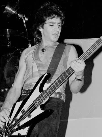 <p>Michael Ochs Archives/Getty</p> Alec John Such of the hard rock group Bon Jovi performs onstage in 1984 in Los Angeles