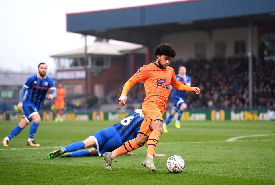 Deandre Yedlin of Newcastle United runs past Eoghan O'Connell of Rochdale. (Credit: Getty Images)