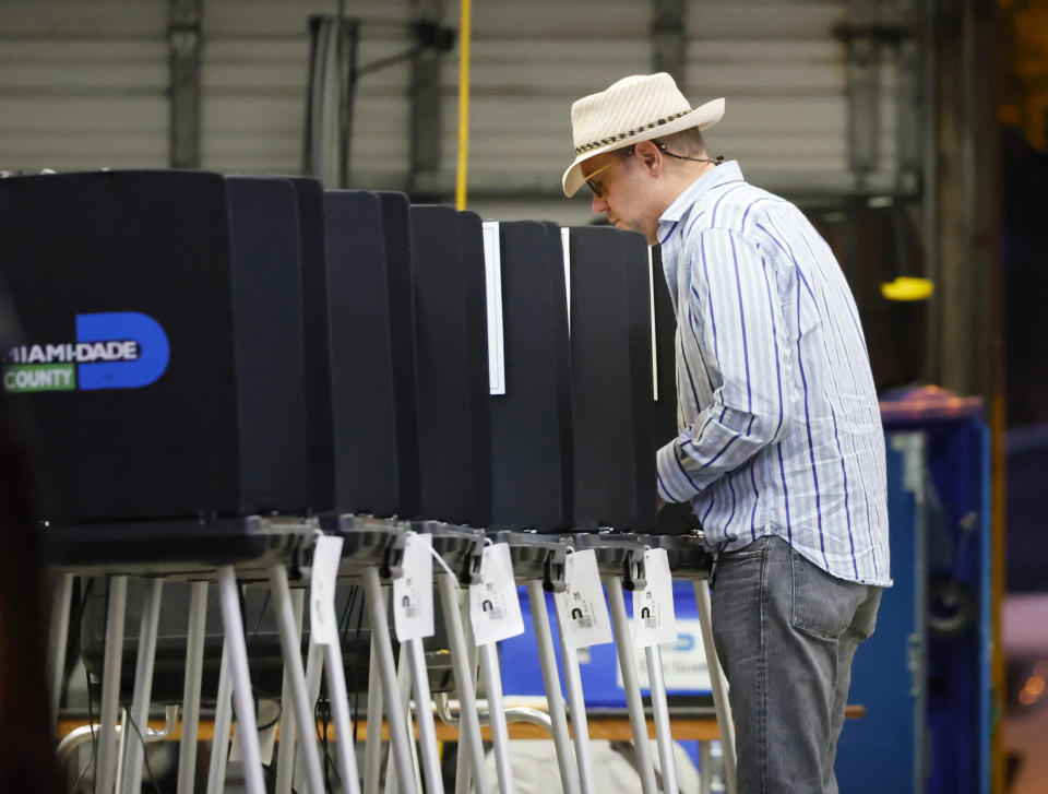 A voter cast his ballots during the Miami General Municipal and Special Elections in Miami-Dade County at Miami Beach Fire Department - Station 3 on Tuesday, Nov. 2, 2021 in Miami Beach, Fla. (David Santiago/Miami Herald via AP)