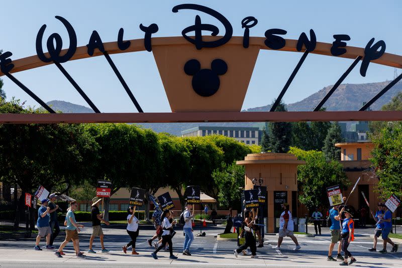 FILE PHOTO: Hollywood actors and writers on strike outside Disney studios in California