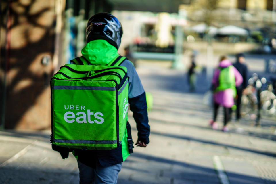 Gothenburg, Sweden - April 11, 2019: Uber eats delivery person carrying food to people who order by online app