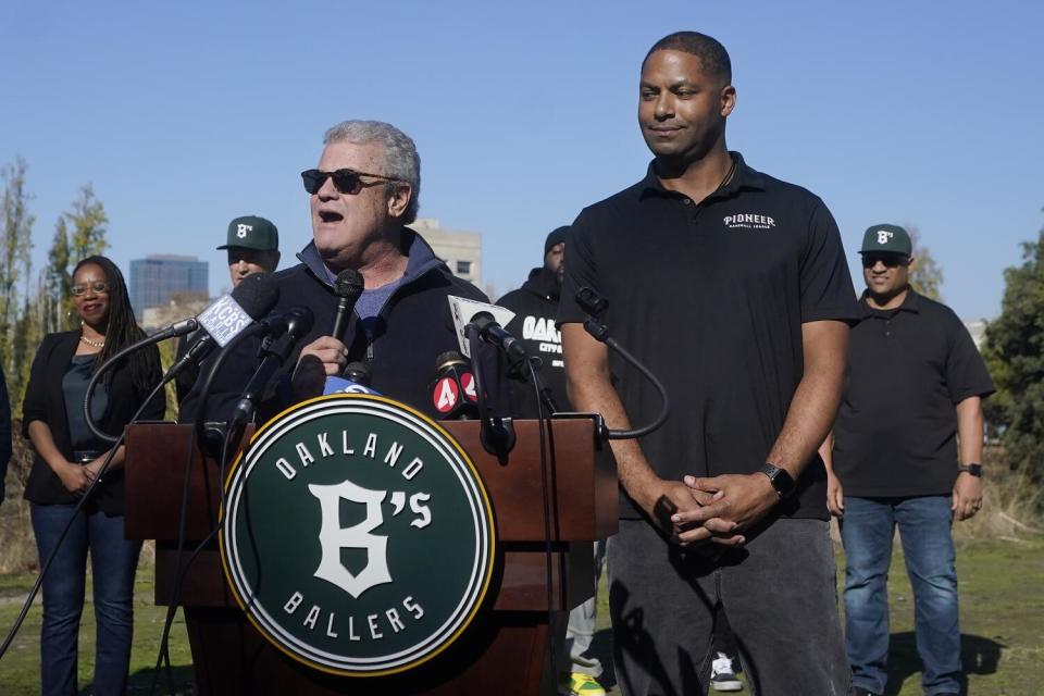 Pioneer League President Mike Shapiro, left, speaks next to Commissioner and Executive Vice President Henry Hunter.