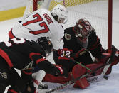 Washington Capitals right wing T.J. Oshie (77) scores against Ottawa Senators goaltender Filip Gustavsson (32) during second-period NHL hockey game action in Ottawa, Ontario, Monday, Oct. 25, 2021. (Justin Tang/The Canadian Press via AP)