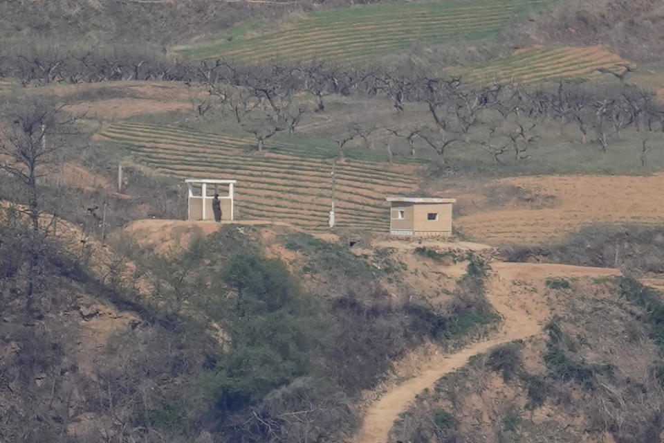 A North Korean soldier stands near a military guard post, seen from the unification observatory in Paju, South Korea, Friday, April 15, 2022. North Korea is marking a key state anniversary Friday with calls for stronger loyalty to leader Kim Jong Un, but there was no word on an expected military parade to display new weapons amid heightened animosities with the United States. (AP Photo/Lee Jin-man)