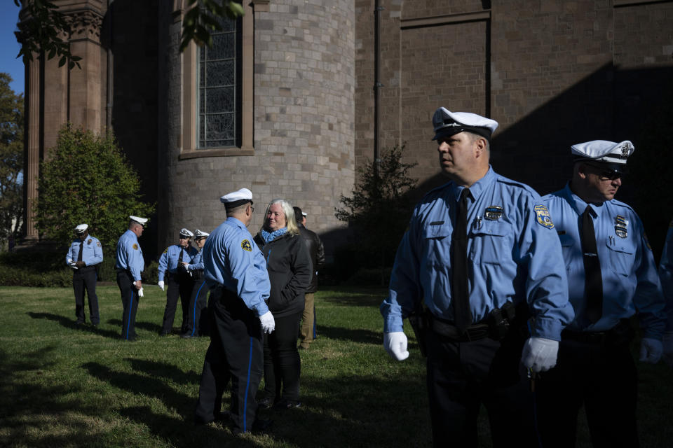Law enforcement officers gather for a viewing for officer Richard Mendez at the Cathedral Basilica of Saints Peter and Paul in Philadelphia, Tuesday, Oct. 24, 2023. Mendez was shot and killed, and a second officer was wounded when they confronted people breaking into a car at Philadelphia International Airport, Oct. 12, police said. (AP Photo/Joe Lamberti)