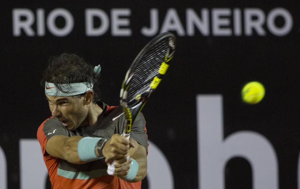 Rafael Nadal, of Spain, returns the ball to Pablo Andujar, of Spain, during a semifinal match at the Rio Open tennis tournament in Rio de Janeiro, Brazil, Saturday, Feb. 22, 2014. (AP Photo/Leo Correa)