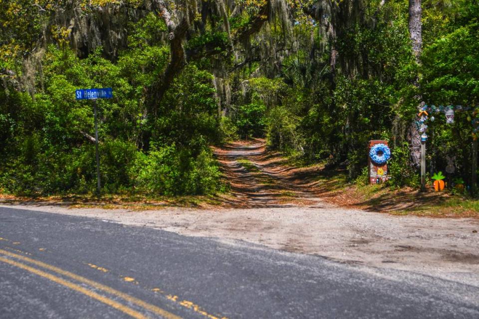 St. Helenville Rd., a private dirt road of twists and turns that cuts through a dense forest of live oaks dripping with Spanish moss, eventually leads to a narrow bridge that takes drivers onto Pine Island.