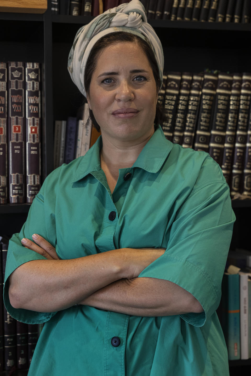 Rabbanit Shira Marili-Mirvis, the first woman chosen as sole spiritual leader of Orthodox community in the Shirat Hatamar synagogue, poses for a photo at her home in the West Bank settlement of Efrat on Tuesday, Oct. 5, 2021. (AP Photo/Tsafrir Abayov)