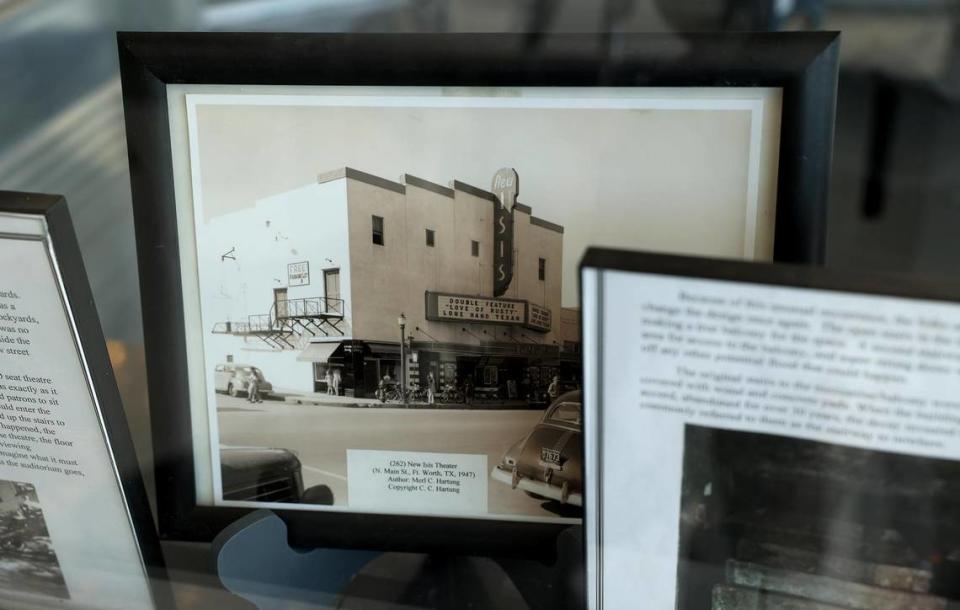 Historic photographs of the the Isis Theatre are displayed in the original ticket booth on Tuesday, August 9, 2022. Amanda McCoy/amccoy@star-telegram.com