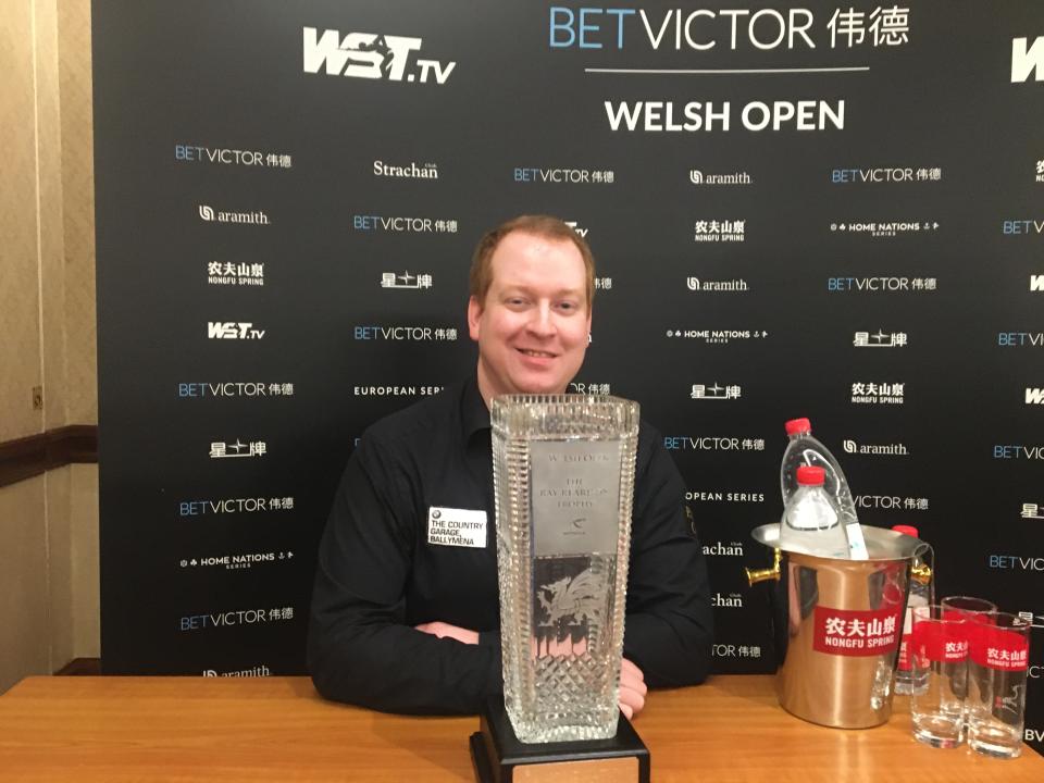 Jordan Brown celebrates with the Ray Reardon Trophy after shocking Ronnie O'Sullivan in the Welsh Open final
