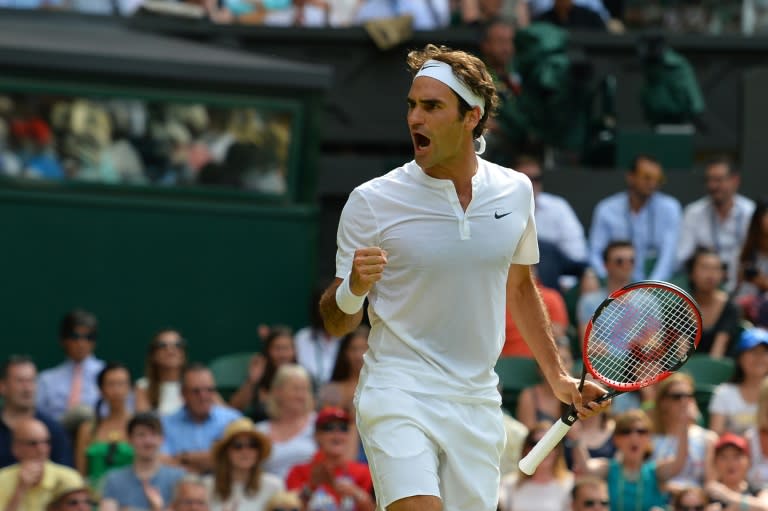 Switzerland's Roger Federer celebrates winning a game in the first set, against Sam Querrey of the US, during their men's singles second round match of the Wimbledon Championships, at the All England Tennis Club in south-west London, on July 2, 2015